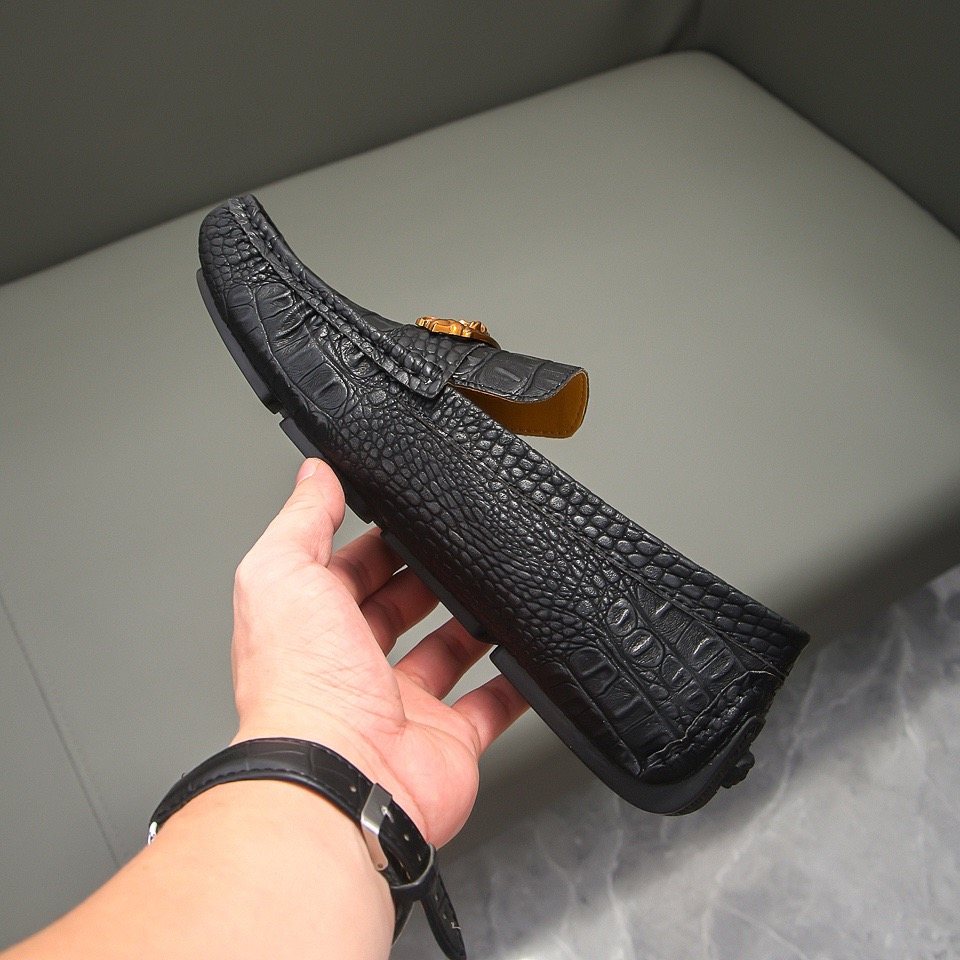 Men's Black Textured Loafers with Gold-Tone Ornament — model