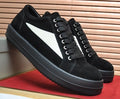 Rick Owens Black Low-Top Sneakers with White Side Panels — hero